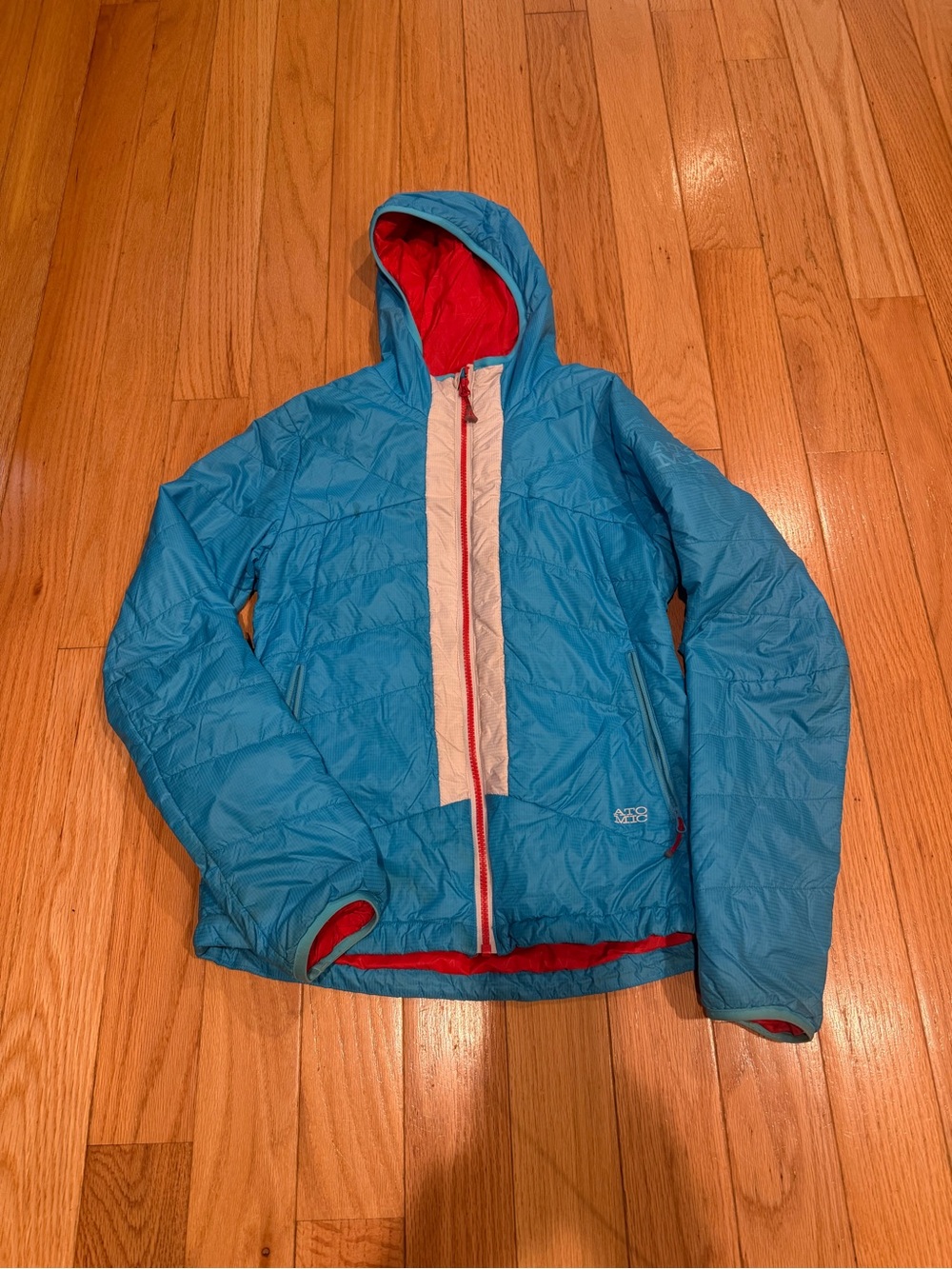 Atomic Blue Hooded Puffer Jacket with Red Lining